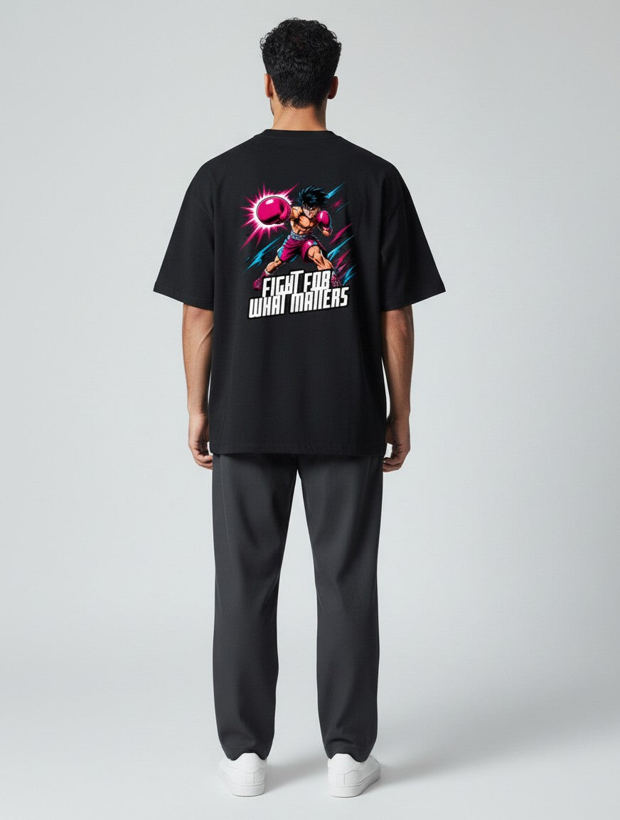 CosmoOtaku black unisex cotton t-shirt with a retro anime boxing graphic on the back, featuring pink and teal accents.