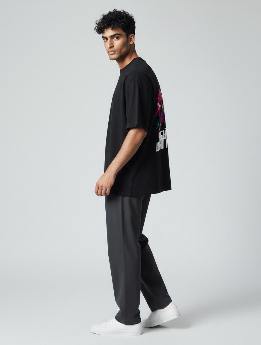 CosmoOtaku black cotton t-shirt with anime boxing graphic on back, worn by a man in a studio setting.