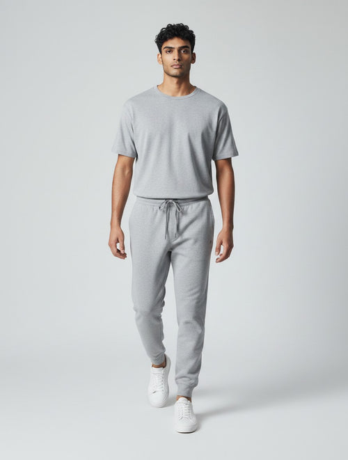CosmoOtaku unisex grey melange joggers in 260 GSM cotton with a tapered fit, ribbed cuffs, and drawstring waistband.