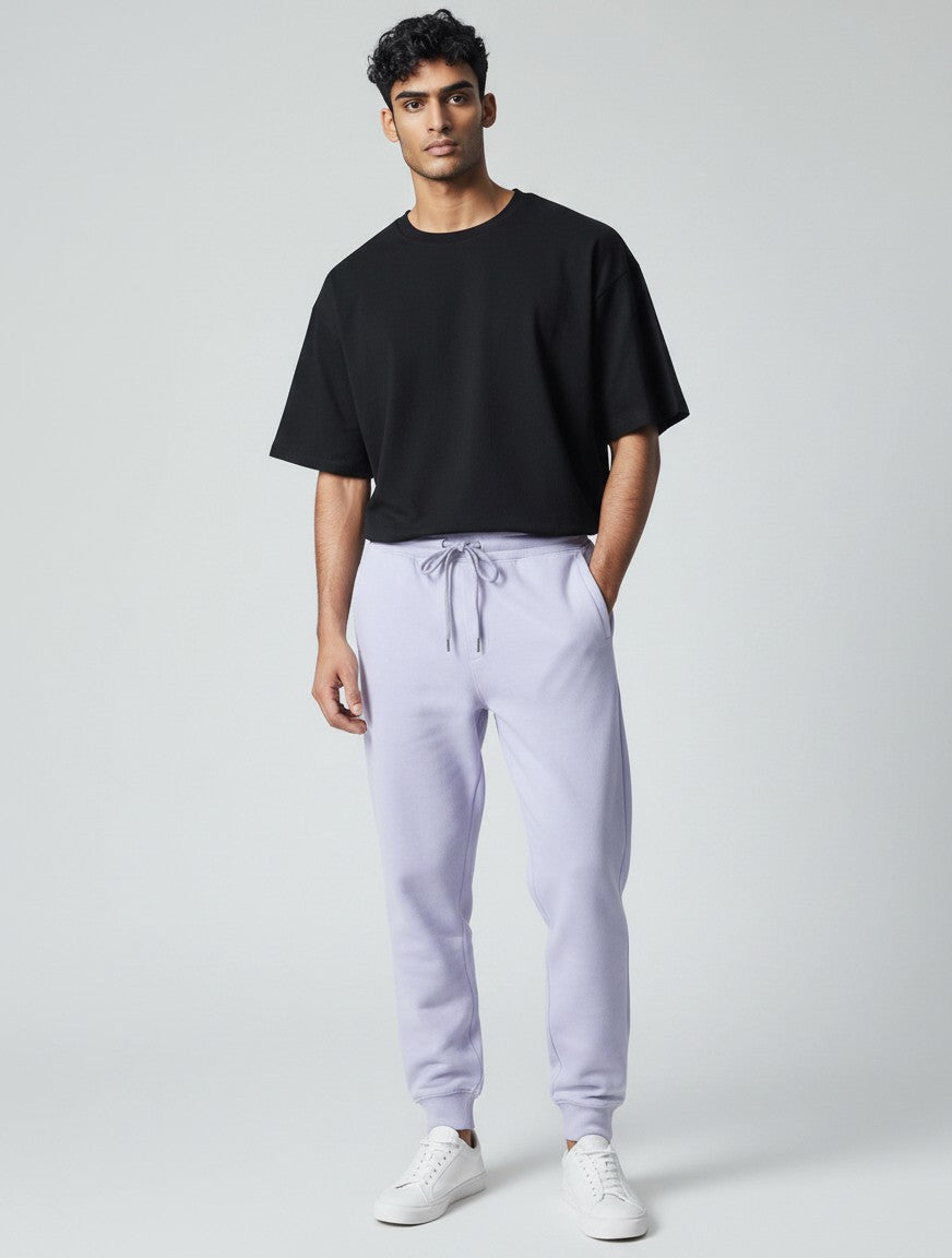Model wearing CosmoOtaku lavender 100% cotton joggers with a drawstring waist and tapered ribbed cuffs