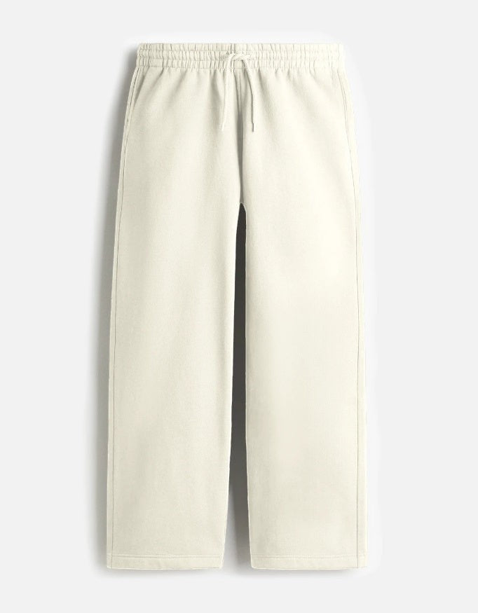 CosmoOtaku off-white relaxed fit lounge sweatpants with an adjustable drawstring waistband and side pockets.